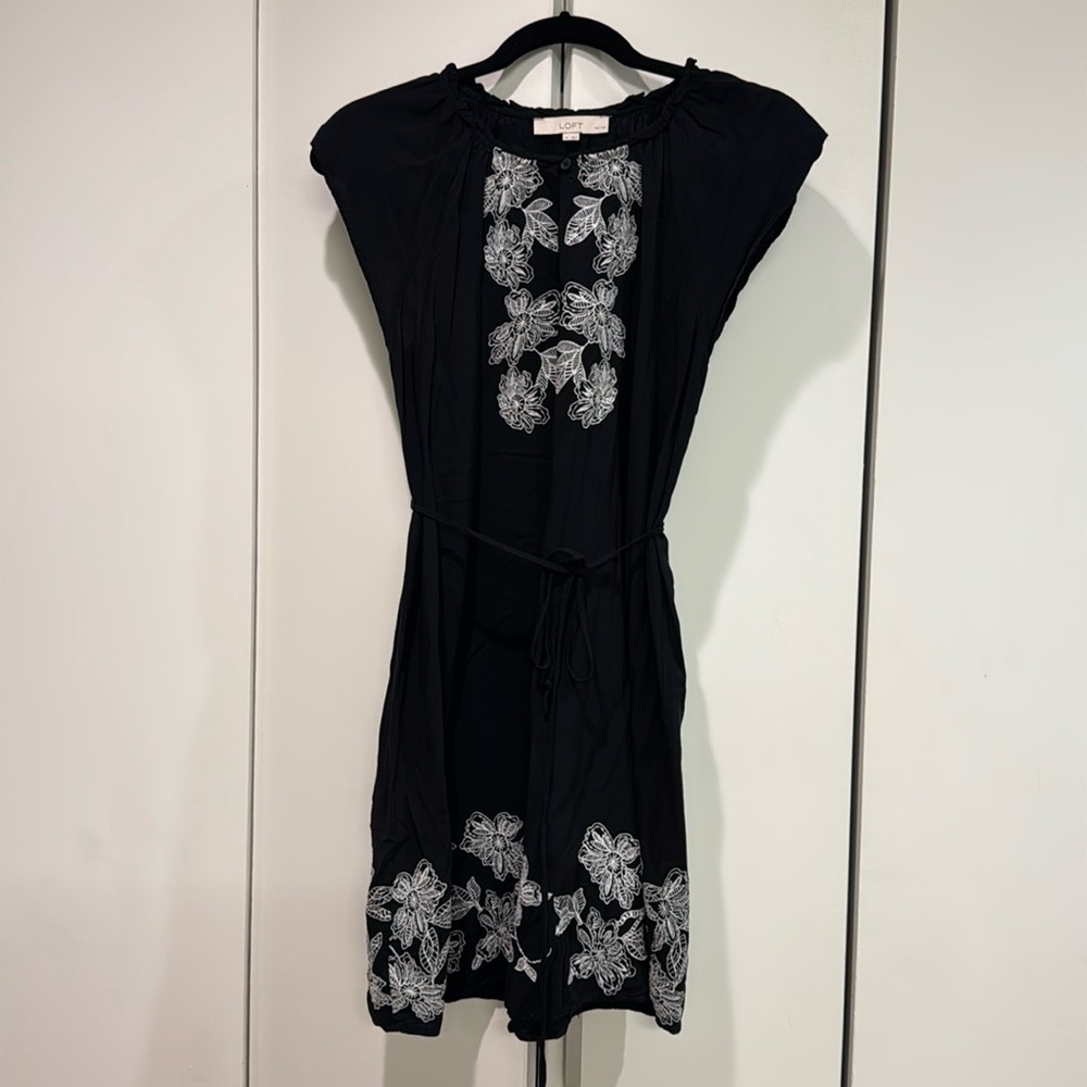 Black mini dress with white floral stitching